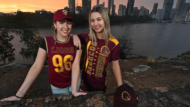 Footy tragics, sisters Belinda, 19, and Emma Gough, 17, are gearing up for a ripper weekend of footy madness with of their teams, the Lions and Broncos, making the AFL and NRL grand finals. Picture: Lyndon Mechielsen