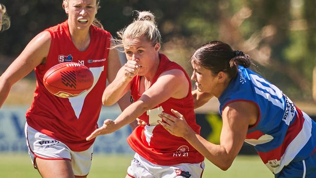 Lauren Daniel getting tackled by Shannon Murphy at X Convenience Oval, in the SANFLW match between Central District and North Adelaide, Saturday, Feb. 22, 2020. (AAP Image/MATT LOXTON)