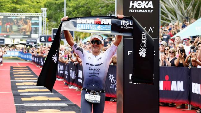 Braden Currie crosses the finish line on the Cairns Esplanade to win the Ironman Cairns Asia Pacific Championship. Picture: Brendan Radke