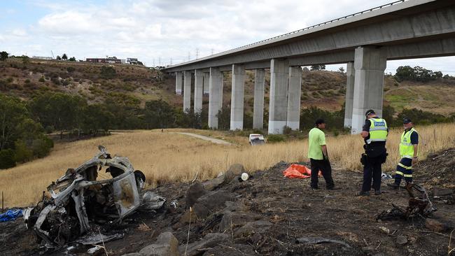 Police at the crash scene at EJ Whitten bridge. Picture: Nicole Garmston