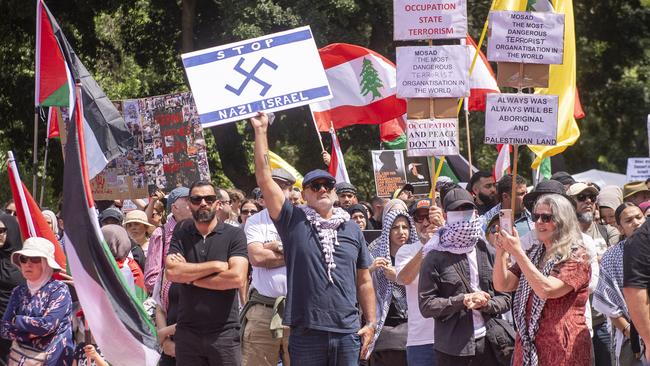 Nomad restaurant founder Al Yazbek brandishes a sign bearing a swastika at a pro-Palestine rally in Hyde Park in October. Picture: Jeremy Piper