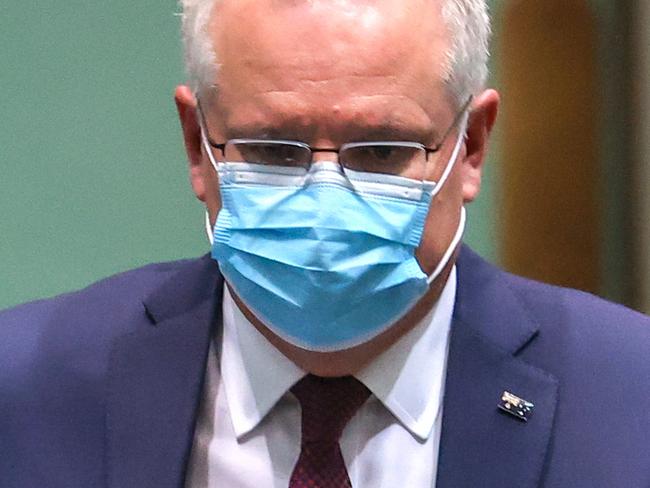 CANBERRA, AUSTRALIA - SEPTEMBER 2: Australian Prime Minister Scott Morrison wears a face mask as he walks out of the House of Representatives after Question Time at Parliament House on September 2, 2020 in Canberra, Australia. Australia's GDP figures released today have confirmed the country's first recession since 1990-1991 with the economy shrinking by 6.3 percent in the past 12 months. It is Australia's deepest economic contraction since the 1930s during the Great Depression.  (Photo by David Gray/Getty Images)