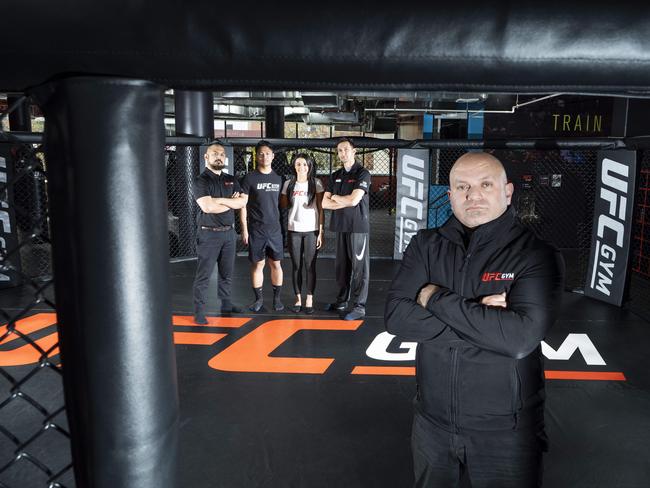 UFC Gym manager George Barkho with staff Justin De Castro, Bao Le, Victoria Ardita and Tim Generoso. Picture: Matthew Vasilescu