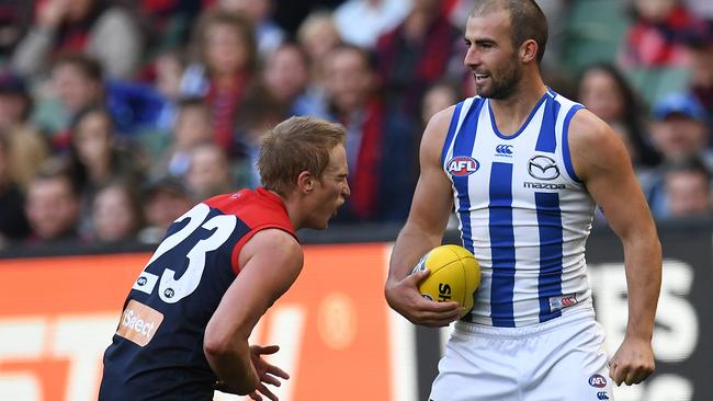 Roo Ben Cunnington punches Demon Bernie Vince in the stomach last week. Picture: Julian Smith (AAP).