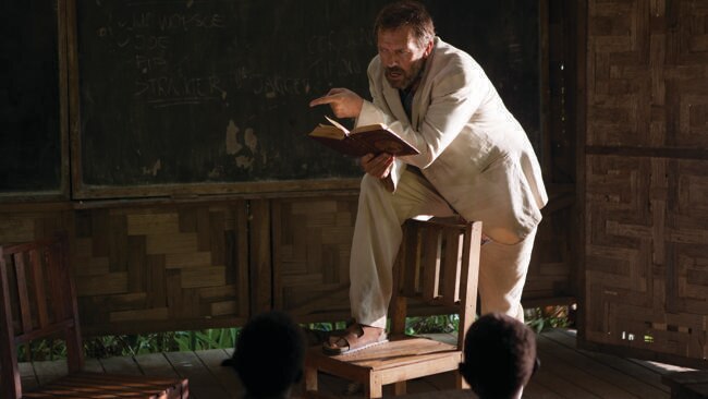 Hugh Laurie as Mr Watts reading  to his students in a scene from the film .