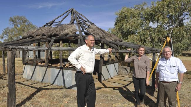 Chief Minister Adam Giles, CLP candidate for Namatjira Heidi Williams and Hamilton Downs Youth Camp chairman Ren Kelly inspect the old meat house. PICTURE: Rex Nicholson