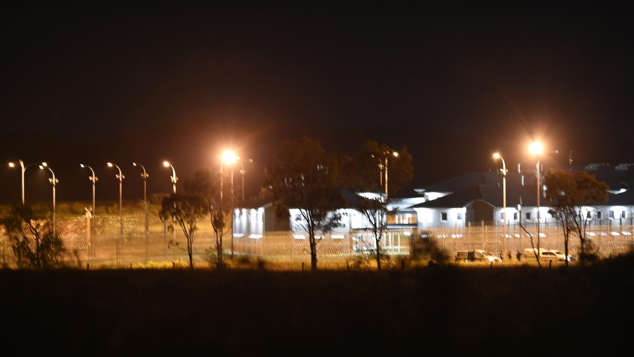 Police vehicles at the perimeter of the Capricornia Correctional Centre during the riot.