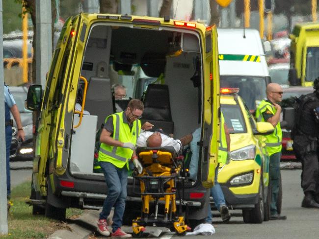 An injured person is loaded in an ambulance following a shooting at the Masjid Al Noor mosque in Christchurch. Picture: AAP