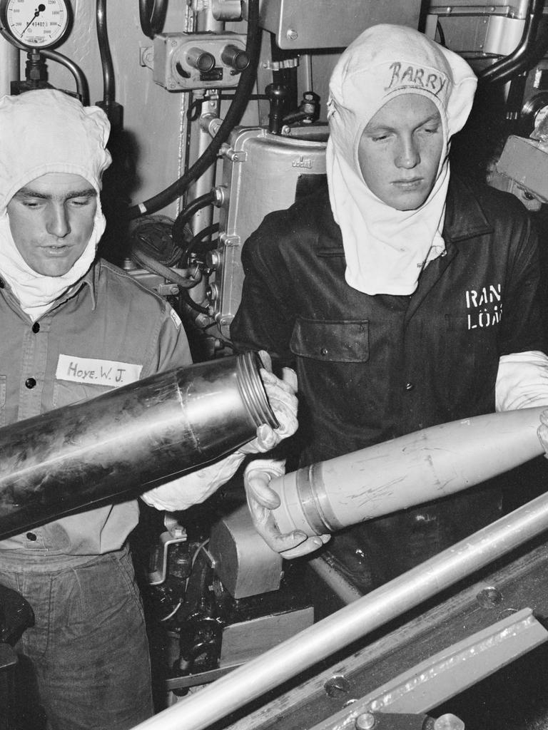 Here R66581 Ordinary Seaman Weapons Mechanic (ORDWM) Warwick John Hoye (left), of Hornsby, NSW, and another seaman, (possibly R95200 Kevin James Barry) load 4.5 inch shells on board the Derwent. Pic: The Australian War Memorial