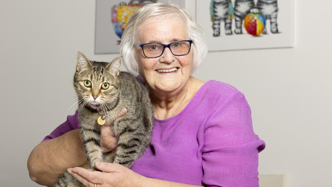 Shirley Teua was the first patient to have a knee replacement at Mater Private Hospital Redland with the new Rosa the Robot. Eight weeks after the surgery, she is happy at home with her six-year-old cat, Ellie. Pictures: Renae Droop/RDW Photography