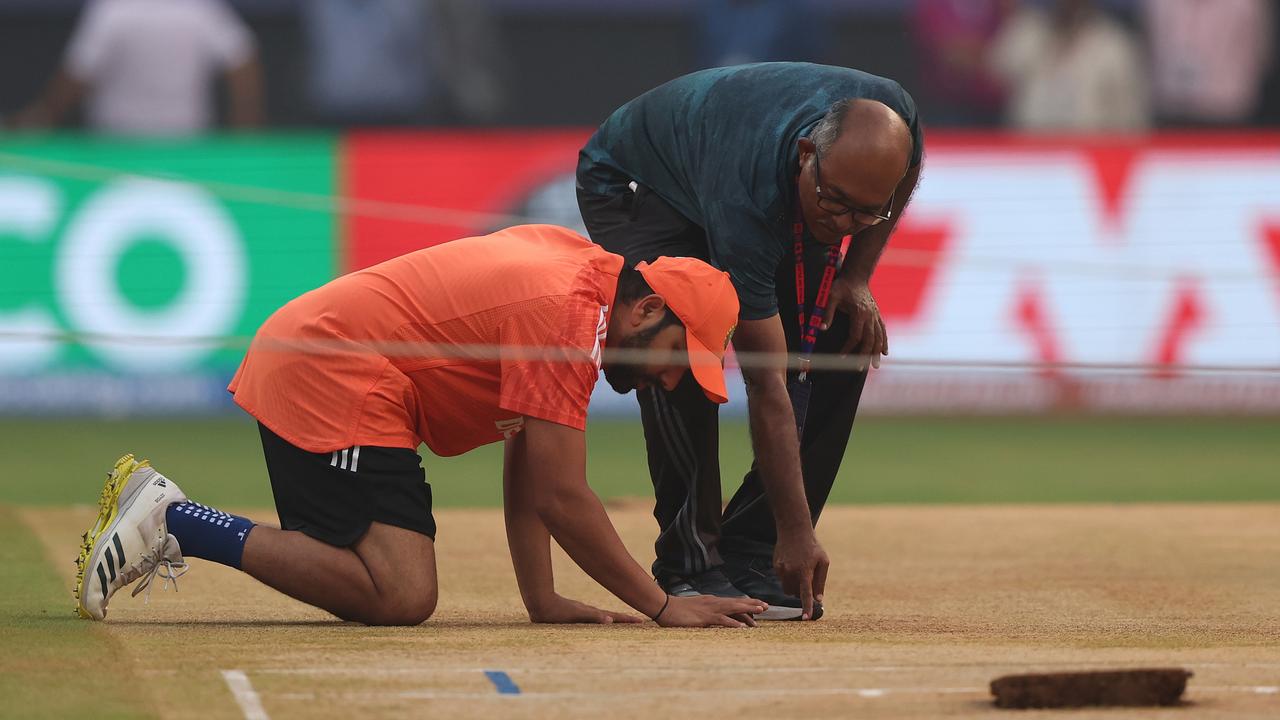 Rohit Sharma of India inspects the pitch ahead of the semifinal against New Zealand. (Photo by Robert Cianflone/Getty Images)