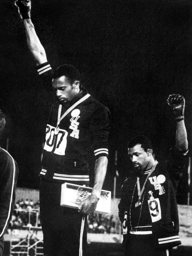 US athletes Tommie Smith (L) and John Carlos (R) raising their gloved fists in the Black Power saluteat the 1968 Olympics. Picture: AFP.