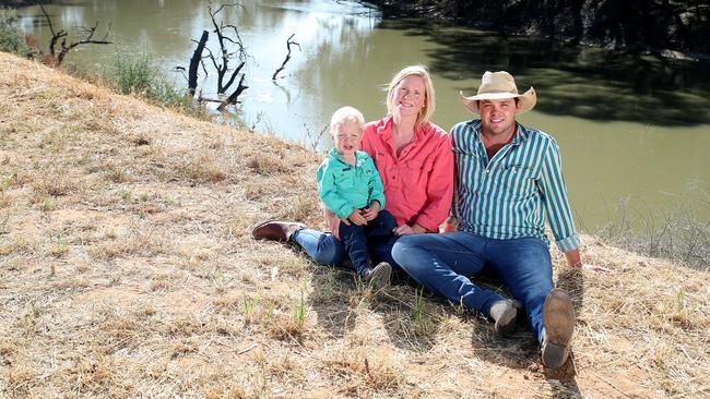 James and Fiona Paterson with son Will on the banks of the Murrumbidgee River near Hay in NSW. Picture Yuri Kouzmin