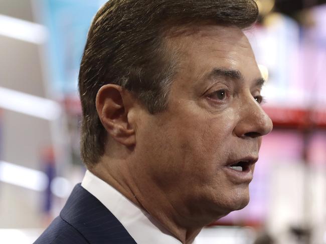 FILE - In this July 17, 2016, file photo, then-Trump campaign chairman Paul Manafort talks to reporters on the floor of the Republican National Convention in Cleveland. U.S. Treasury Department agents have recently obtained information about offshore financial transactions involving Manafort, as part of a federal anti-corruption probe into his work in Eastern Europe, The Associated Press has learned. (AP Photo/Matt Rourke, File)