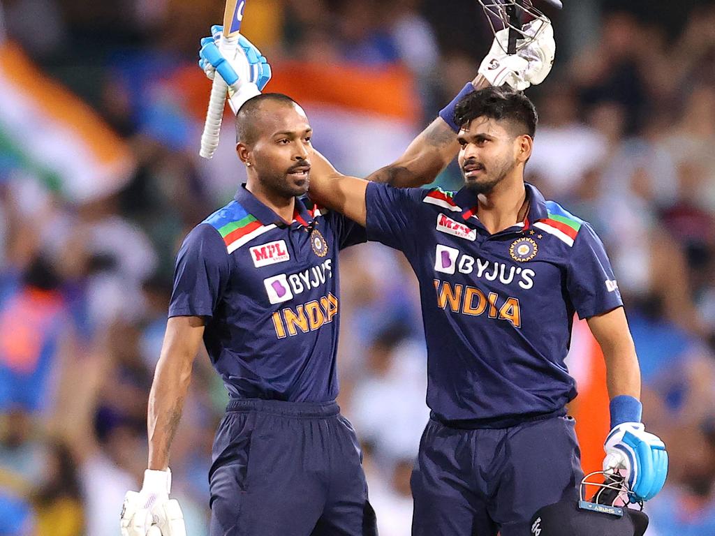 India's batsmen Hardik Pandya (L) and Shreyas Iyer celebrate the victory.