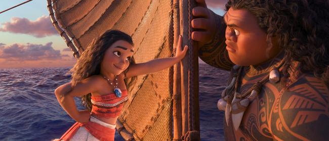 Maui, voiced by Dwayne Johnson, right, and Moana, voiced by Auli'i Cravalho, in a scene from the animated film, Moana. Picture: Disney via AP