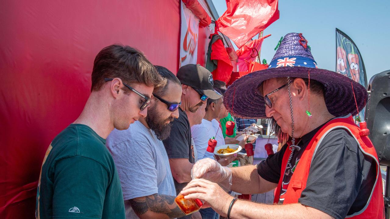 Wayne Marsh serves out the hot sauce at the Murphys Creek Chilli and Craft carnival. Sunday, September 22, 2024. Picture: Nev Madsen