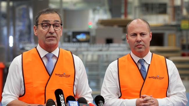 Premier Steven Marshall and federal Treasurer Josh Frydenberg at the Bickford's Salisbury factory on February 22. Picture Dean Martin