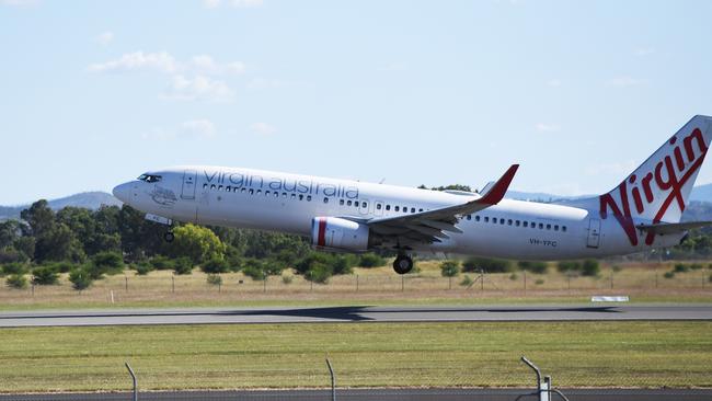 An almost empty Virgin flight VA1244 departs Rockhampton for Brisbane.