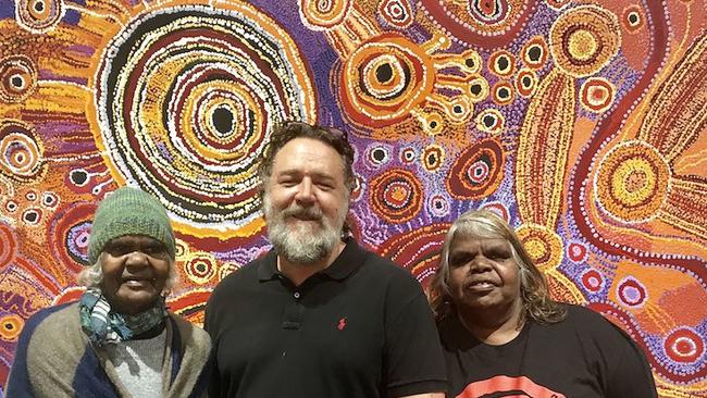 Actor Russell Crowe with APY artists at the APYACC's Sydney gallery. There is no suggestion the art works pictured were interfered with.