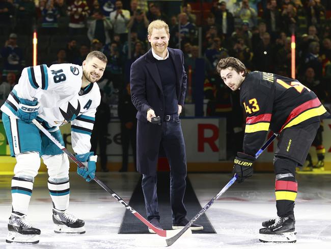 Quinn Hughes #43 of the Vancouver Canucks and Tomas Hertl #48 of the San Jose Sharks take part in a ceremonial faceoff with Prince Harry before their NHL game at Rogers Arena in Vancouver, British Columbia, Canada.Picture: NHLI via Getty Images