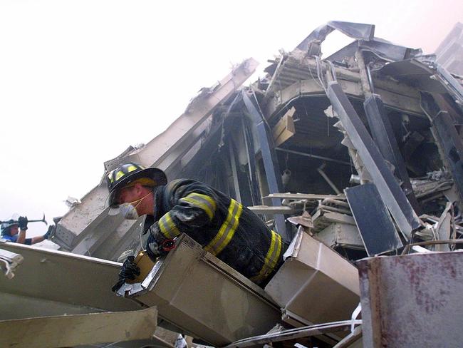 Firefighters make their way through the rubble of the World Trade Center in New York. Picture: Doug Kanter/AFP