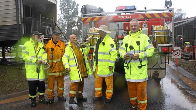 Some of the wonderful RFS volunteers from Bentley Brigade were hard at work helping to clean up Lismore in the rain on Monday afternoon. Picture: Alison Paterson