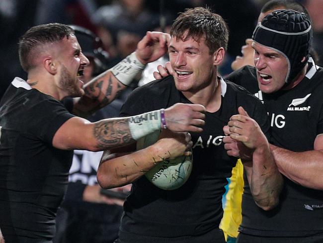 George Bridge of New Zealand is congratulated on scoring a try during the Bledisloe Cup match between the New Zealand All Blacks and the Australian Wallabies at Eden Park in Auckland, New Zealand, Saturday, August 17, 2019. (AAP Image/David Rowland) NO ARCHIVING, EDITORIAL USE ONLY