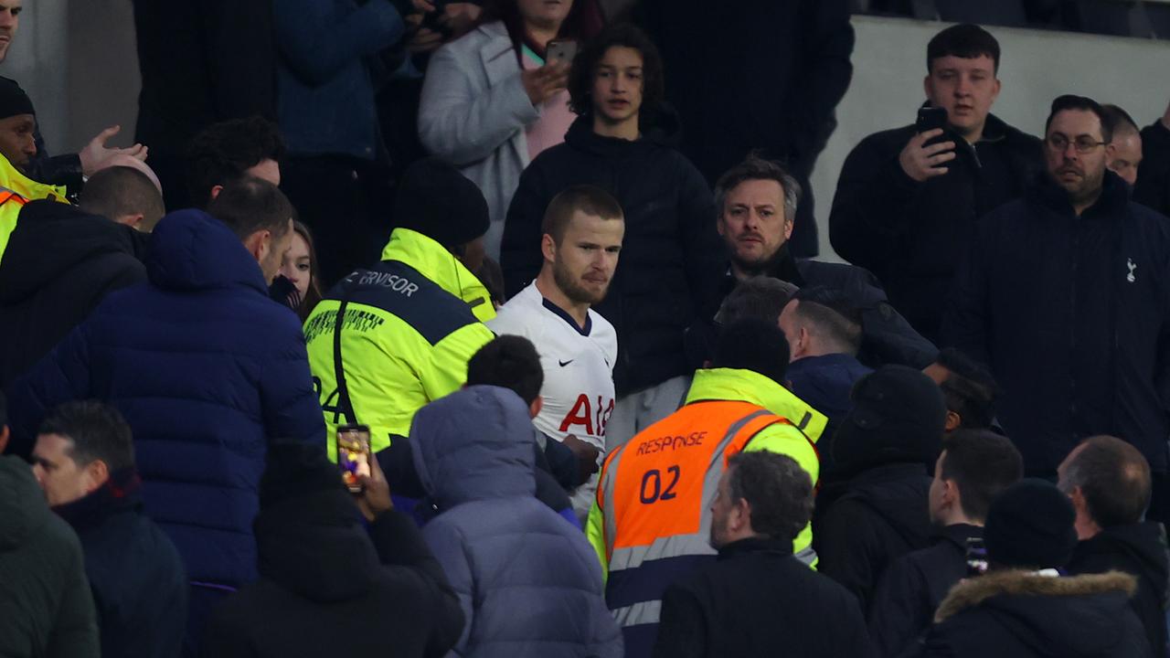 Eric Dier was pulled away by stewards after confronting a fan.