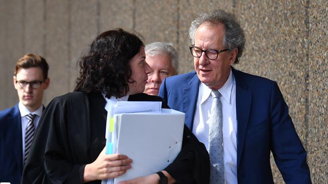 Australian actor Geoffrey Rush (right) arrives at the Federal Court in Sydney, Tuesday, October 23, 2018. Rush is suing Nationwide News for defamation. (AAP Image/Brendan Esposito) NO ARCHIVING