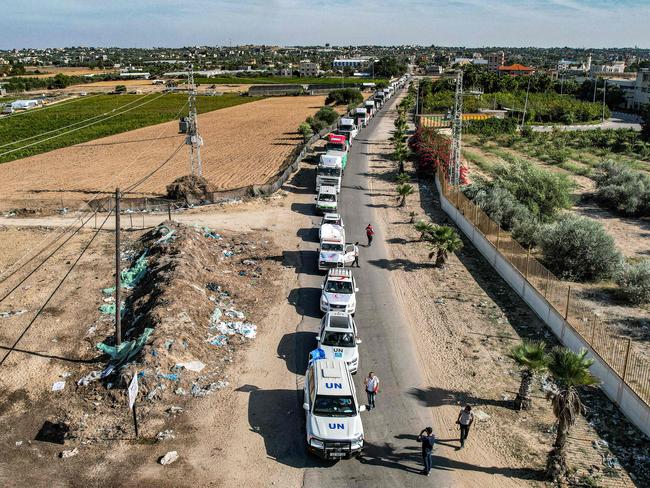 This aerial view shows humanitarian aid trucks arriving from Egypt after having crossed through the Rafah border crossing abd arriving at a storage facility in Khan Yunis in the southern Gaza Strip. Picture: AFP