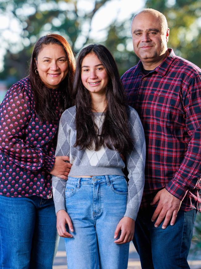 Dany and Cynthia Elachi, pictured with their 14-year-old daughter Aalia, believe children should not have access to social media. Picture: Justin Lloyd