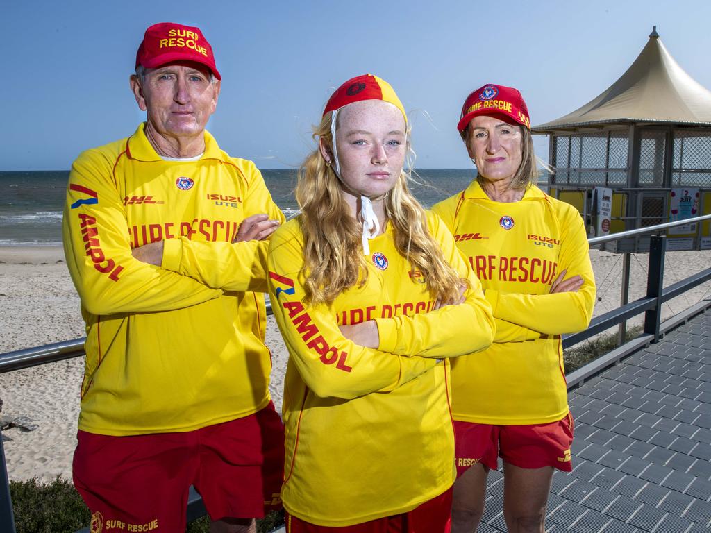 Brighton Surf Club lifesavers Wayne Carruthers ,Ellie Morgan and Judy Carruthers at Adelaide's Brighton Beach. Picture: Mark Brake