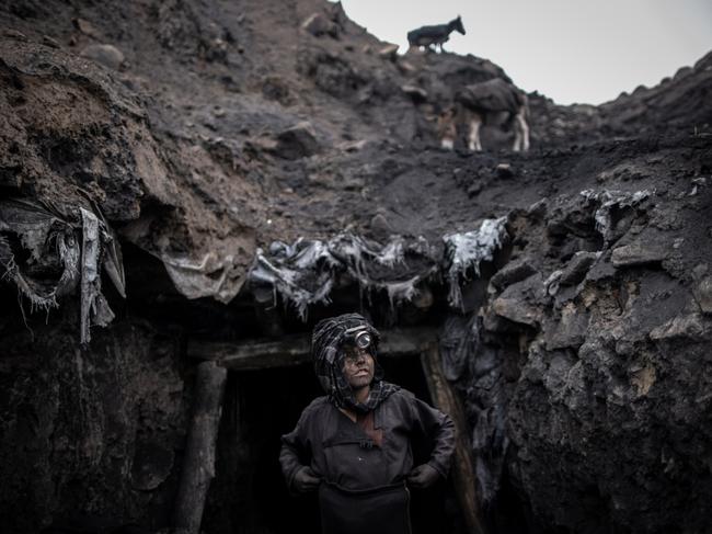 A young boy works in an informal coal mine in Chinarak, Afghanistan. Hundreds of miners, including children as young as 10 and men over 60, toil every day for a few cents. Picture: Weiken Oliver