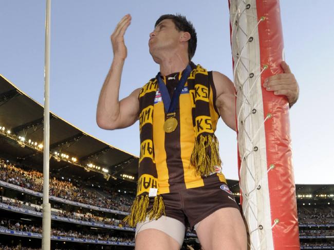 Shane Crawford celebrates with the crowd after claiming the 2008 premiership.