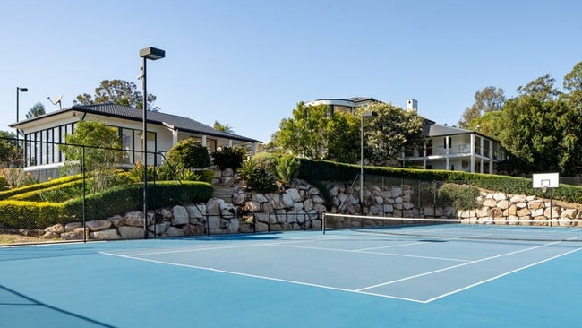 The property’s features include a tennis court.