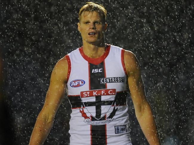 A drenched Nick Riewoldt plays against his St Kilda teammates in the 2012 NAB Cup.