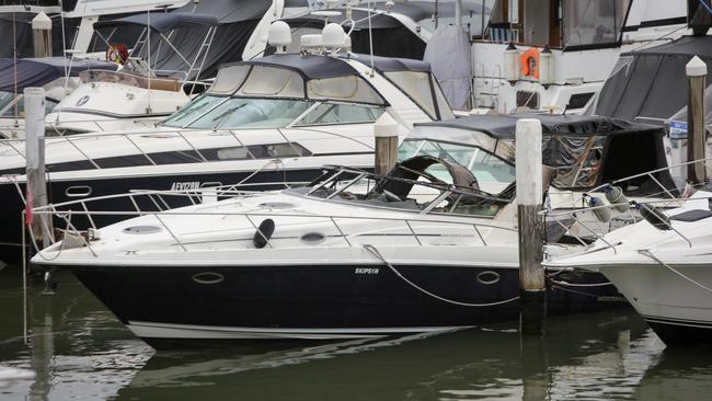 The burnt boat moored at the marina. Picture: Liam Driver