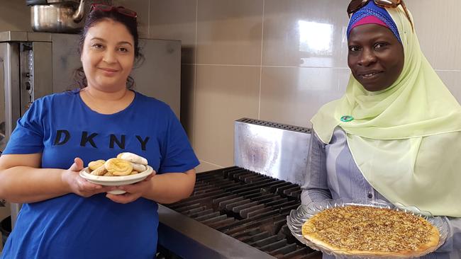 Dima Al Balkhi, community kitchen program participant, and Prosper program coordinator Isha Colley at their Campsie kitchen.
