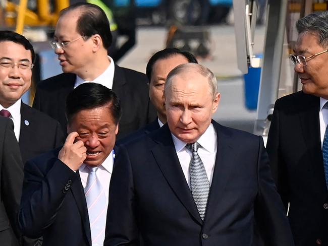 Russia's President Vladimir Putin (2nd R) arrives at Beijing Capital International Airport to attend the Third Belt and Road Forum in Beijing on October 17, 2023. (Photo by Parker Song / POOL / AFP)