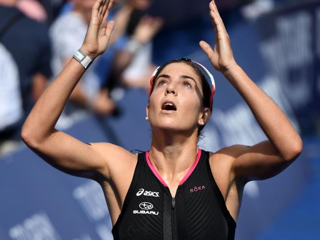 Ashleigh Gentle celebrates winning the Noosa triathlon.