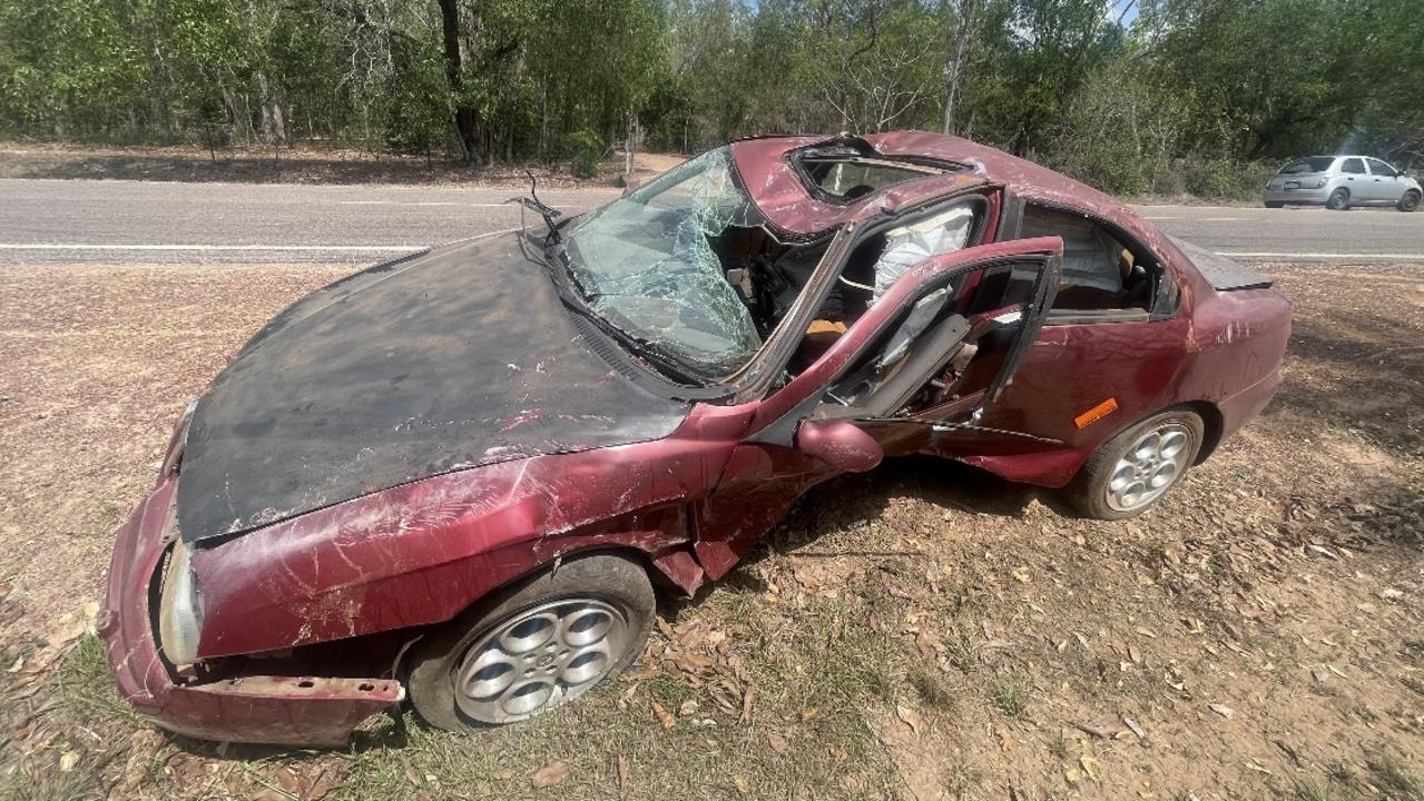 A car was left after a roll-over on the side of Acacia Road in Humpty Doo. Picture: Glenn Campbell