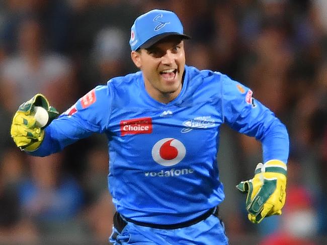 ADELAIDE, AUSTRALIA - JANUARY 21: Alex Carey of the Strikers celebrates after catching the wicket of  Joe Burns of the Heat during the Big Bash League match between the Adelaide Strikers and the Brisbane Heat at Adelaide Oval, on January 21, 2021, in Adelaide, Australia. (Photo by Mark Brake/Getty Images)