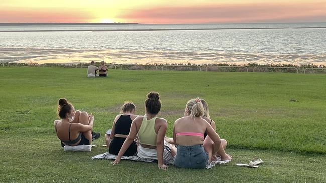 Groups flouted Covid-19 restrictions by not wearing masks and sitting down to watch the sunset. Picture: Judith Aisthorpe