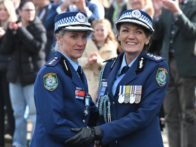 NSW Police Inspector Amy Scott receives the Commissioners Valour Award from the NSW Police Commissioner Karen Webb during a ceremony welcoming 170 new probationary constables at the NSW Police Academy on Friday. Picture: NewsWire