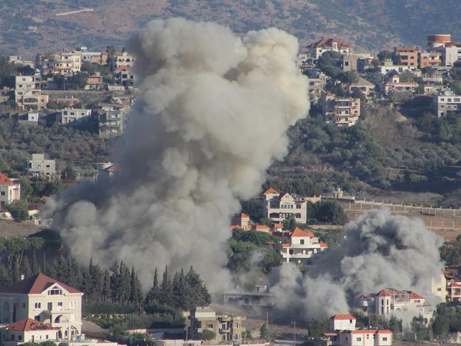 TOPSHOT - Smoke rises from the site of an Israeli airstrike that targeted the southern Lebanese village of Khiam on October 21, 2024. (Photo by AFP)