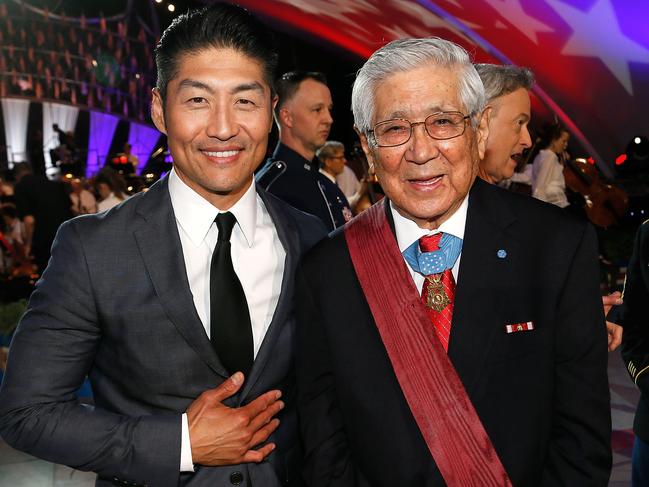 WASHINGTON, DC - MAY 27:  Star of Chicago Med Brian Tee (L) and Korean War veteran Hiroshi "Hershey" Miyamura pose for a photo during the finale of the 2018 National Memorial Day Concert at U.S. Capitol, West Lawn on May 27, 2018 in Washington, DC.  (Photo by Paul Morigi/Getty Images for Capital Concerts)