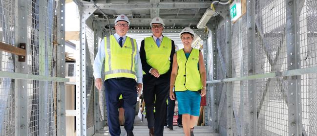 Brad Hazzard, Westmead and Auburn hospital's general manager Brett Thompson and Western Sydney Local Health District chief executive officer Robynne Cooke survey the site.