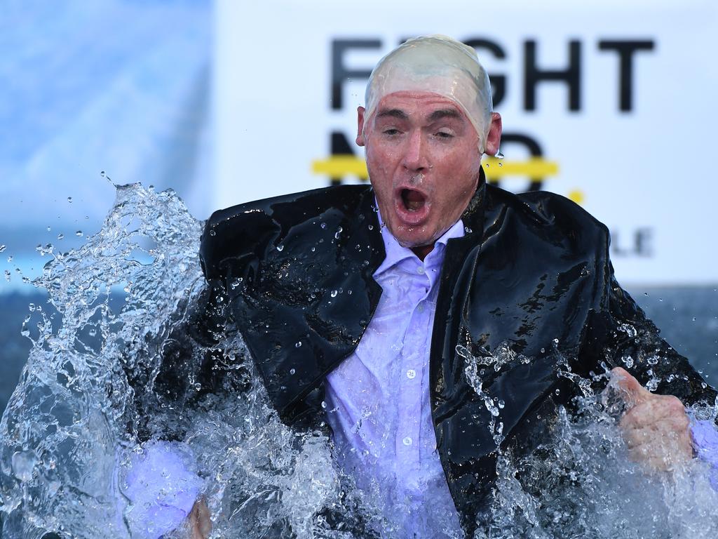 Alan Richardson went down the slide dressed as Mark Robinson. Picture: AAP Image/Julian Smith