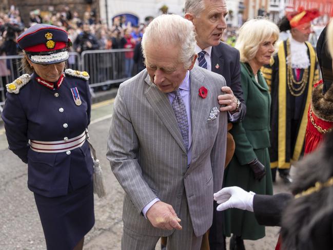 Britain's King Charles III reacts after an egg was thrown in his direction during a ceremony at Micklegate Bar in York, northern England on November 9, 2022 as part of a two-day tour of Yorkshire. - Micklegate Bar is considered to be the most important of York's gateways and has acted as the focus for various important events. It is the place The Sovereign traditionally arrives when entering the city. (Photo by James Glossop / POOL / AFP)